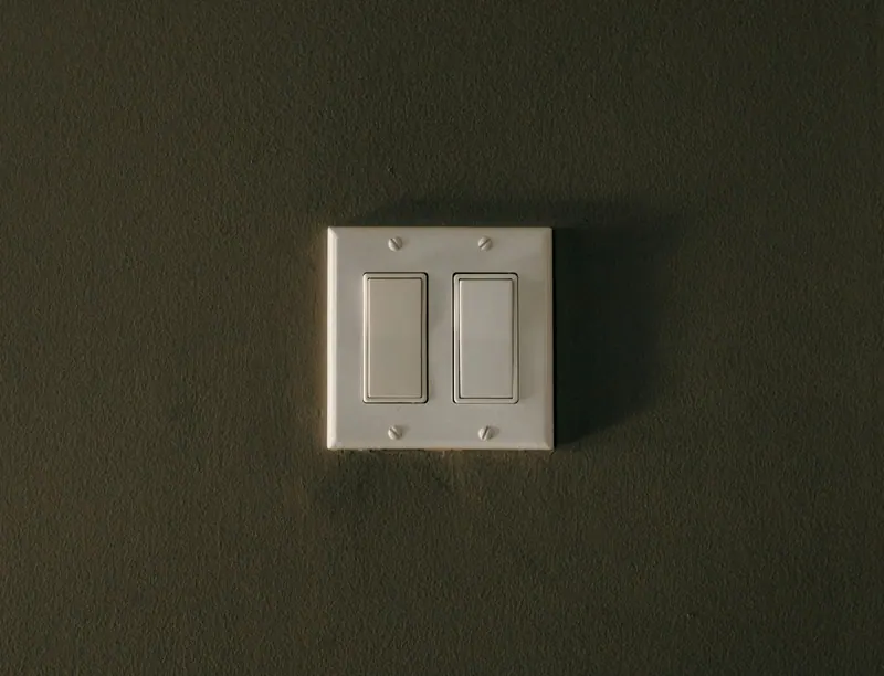 Double light switch on a wall