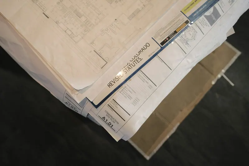 Stack of construction drawings and documents