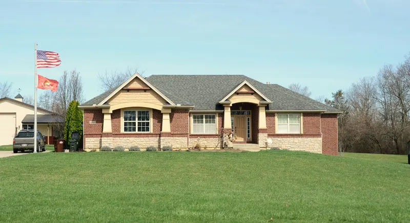 Brick ranch house with a large lawn