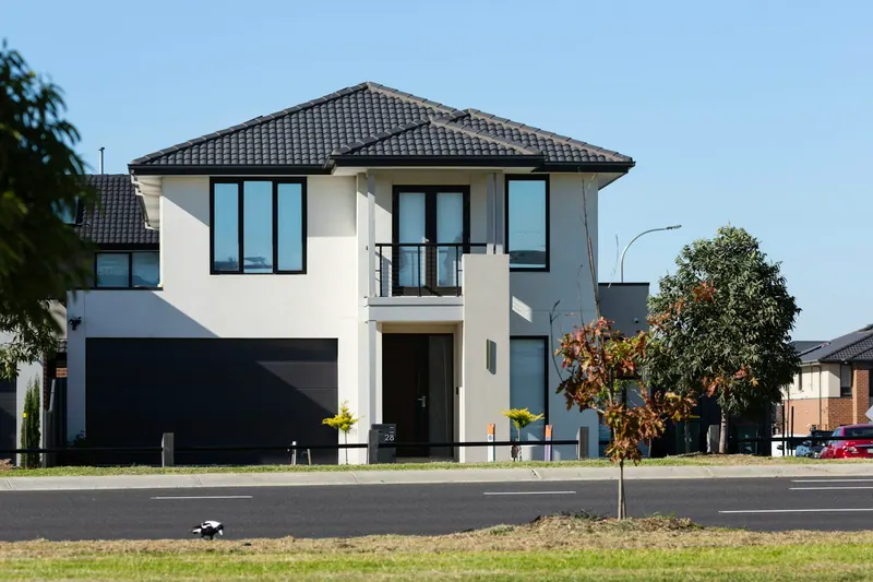Modern two-story house with a dark hip roof